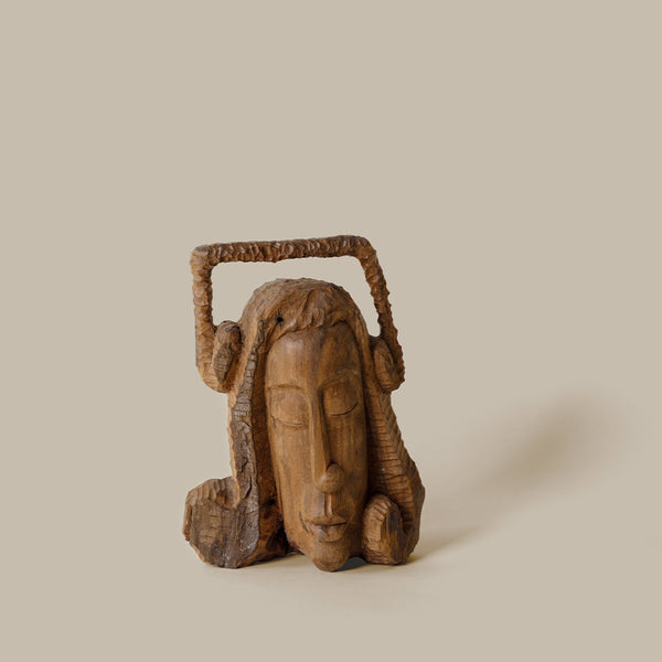 Solid wood carved female head