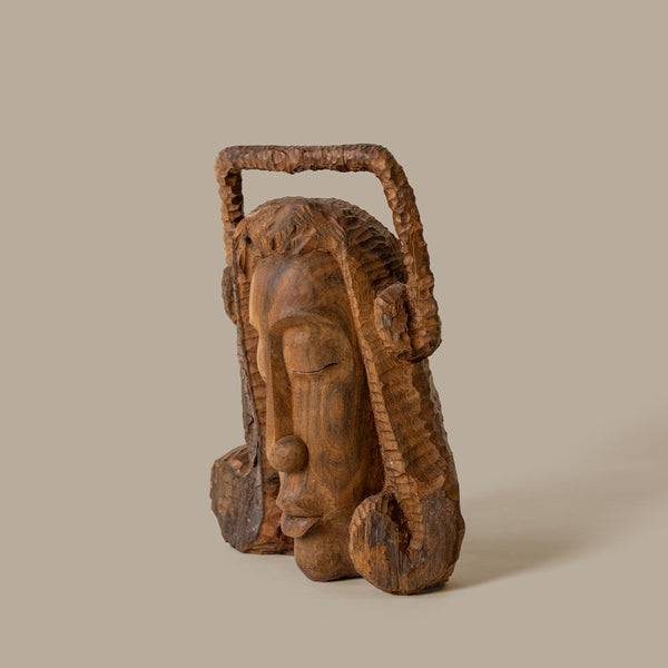 Solid wood carved female head