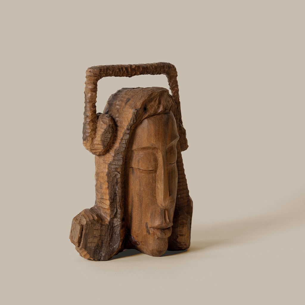 Solid wood carved female head